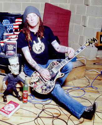 Ginger with his iconic Les Paul